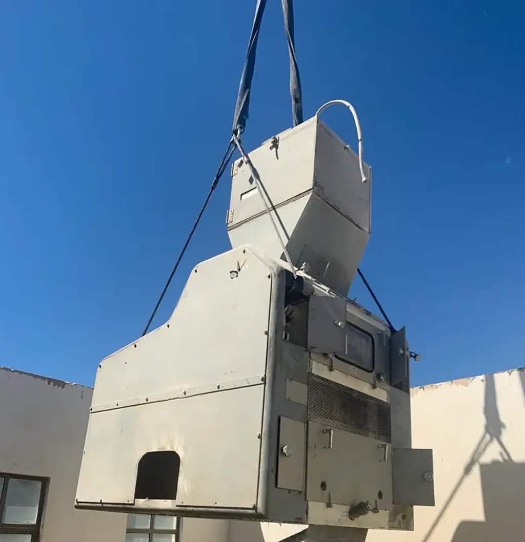 Jacked Co. rigging and crane services performing a precision lift of industrial hopper equipment into a facility.