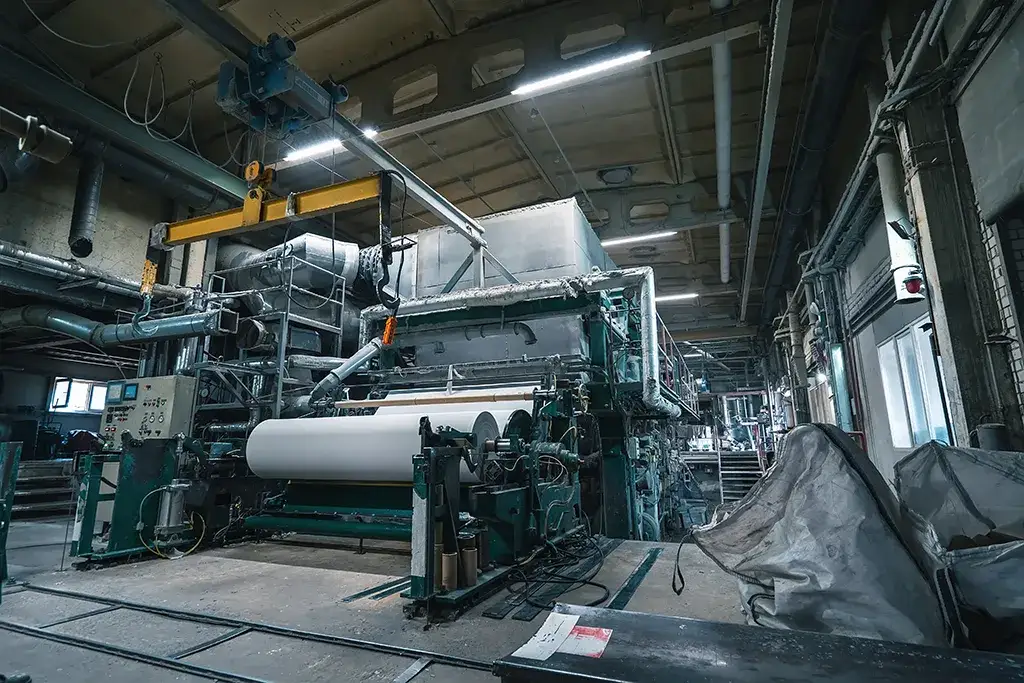 Industrial rigging and machinery services for a large-scale paper and pulp manufacturing facility.