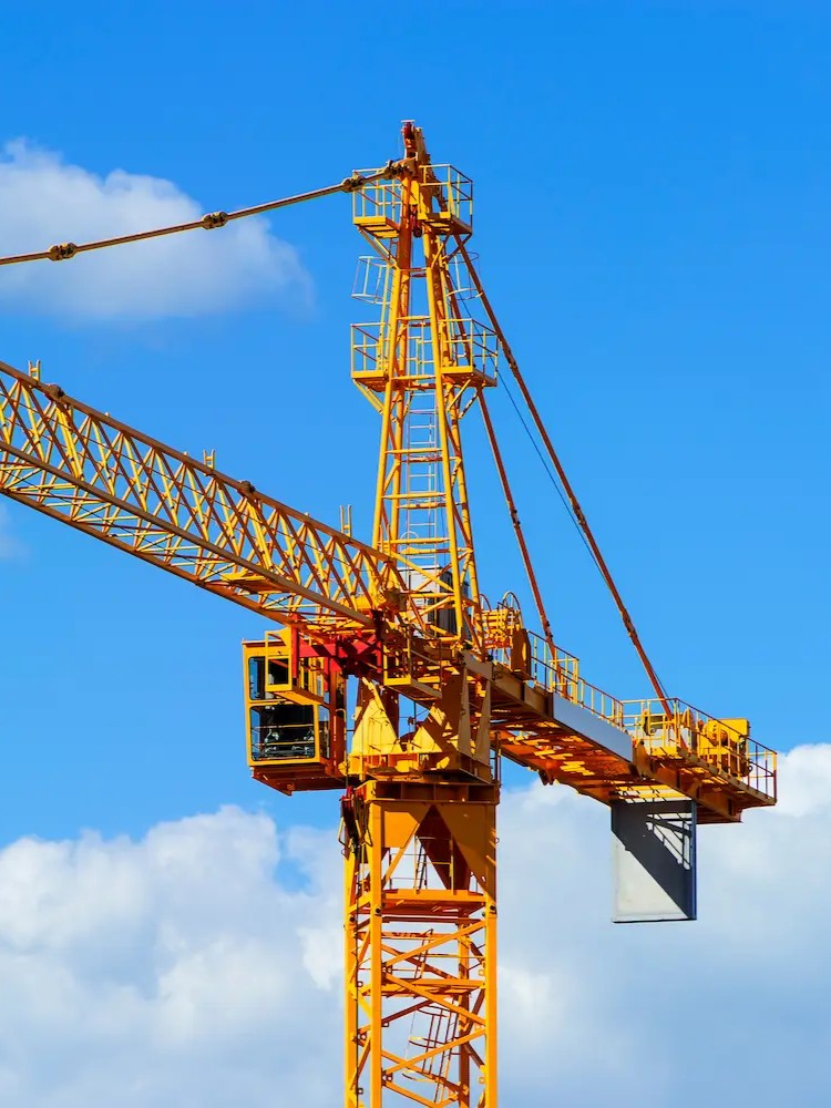 static Jacked Co. crane with a blue sky in the background